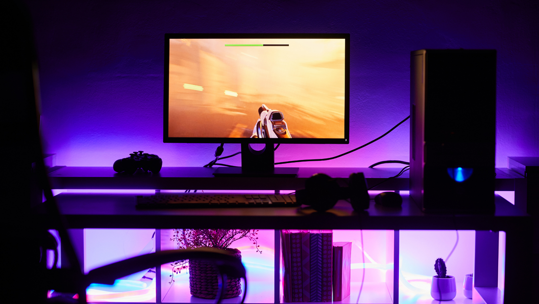 Photo of a monitor and a gaming PC