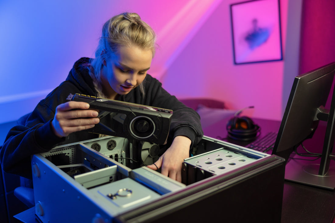 image of a woman upgrading a part of her PC.